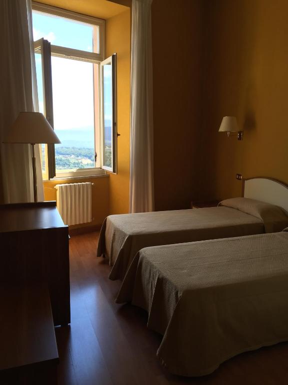 Postel nebo postele na pokoji v ubytování Hotel Relais Filonardi