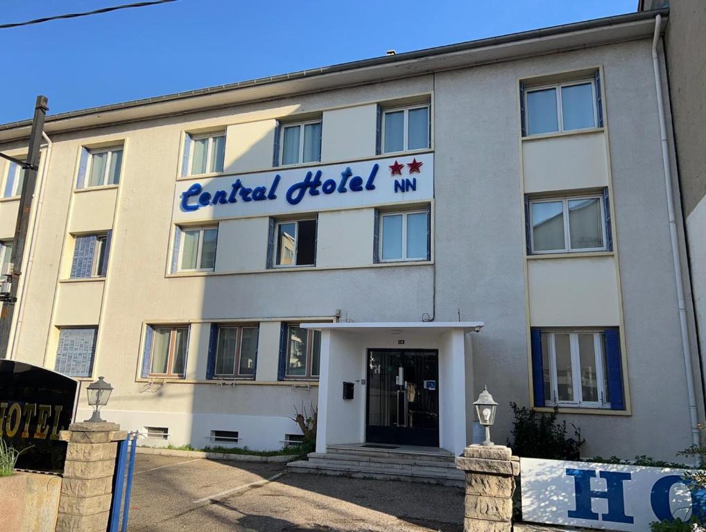 a building with the front of a hotel at Central Hôtel in Saint-Priest