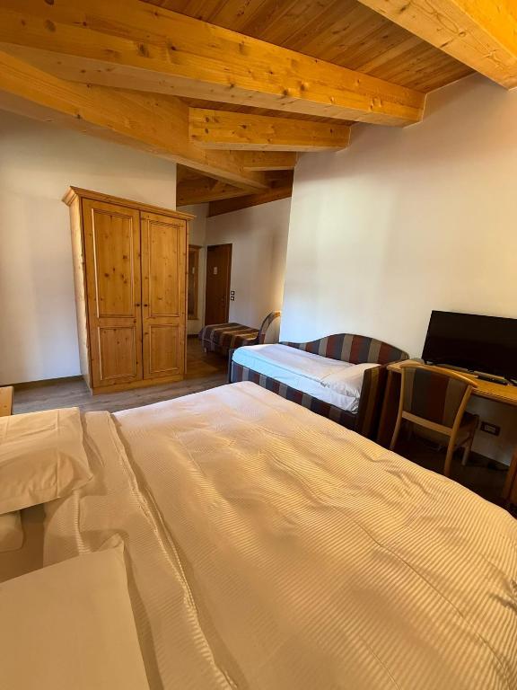 Hotel Villa Fosine Spa & Wellness - Deluxe Dreibettzimmer