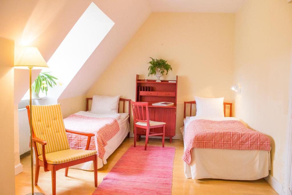 Postel nebo postele na pokoji v ubytování Hesselby Slott