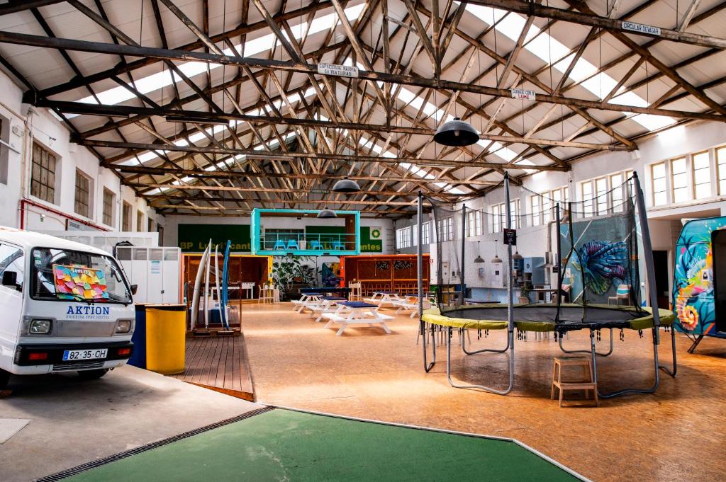 a room with a play area with a trampoline at WOT Peniche Social in Peniche