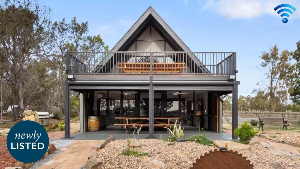a rendering of a house with a balcony at Vineyard Accommodation in Dorrien