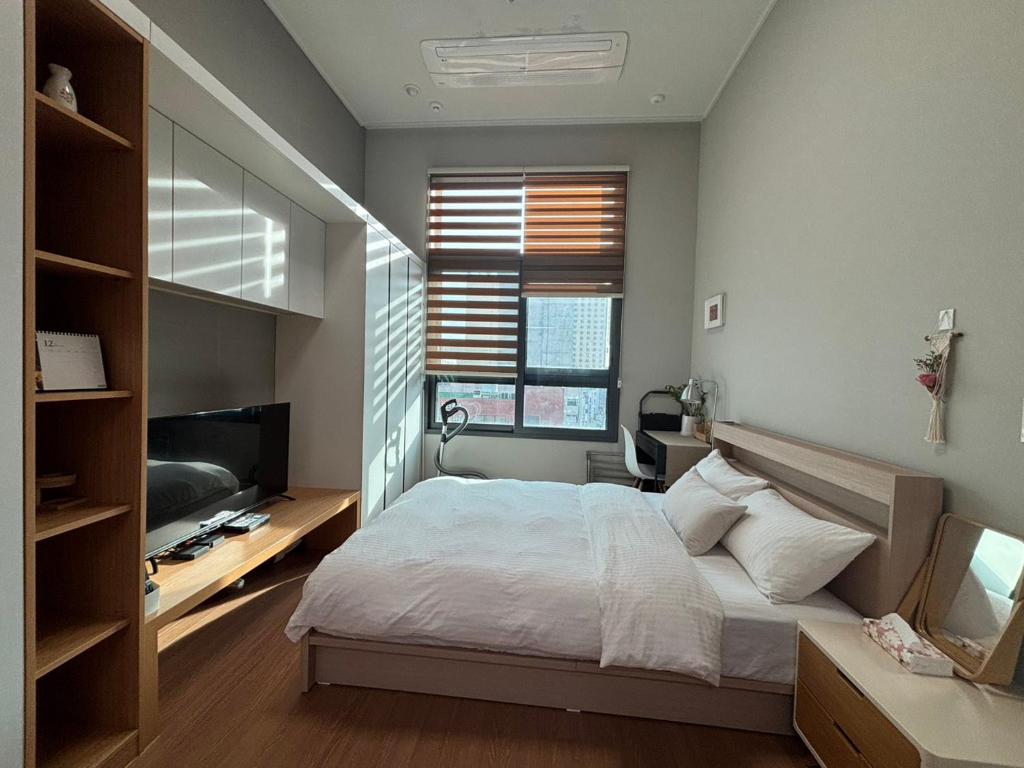 En eller flere senge i et værelse på City Center Duplex Room
