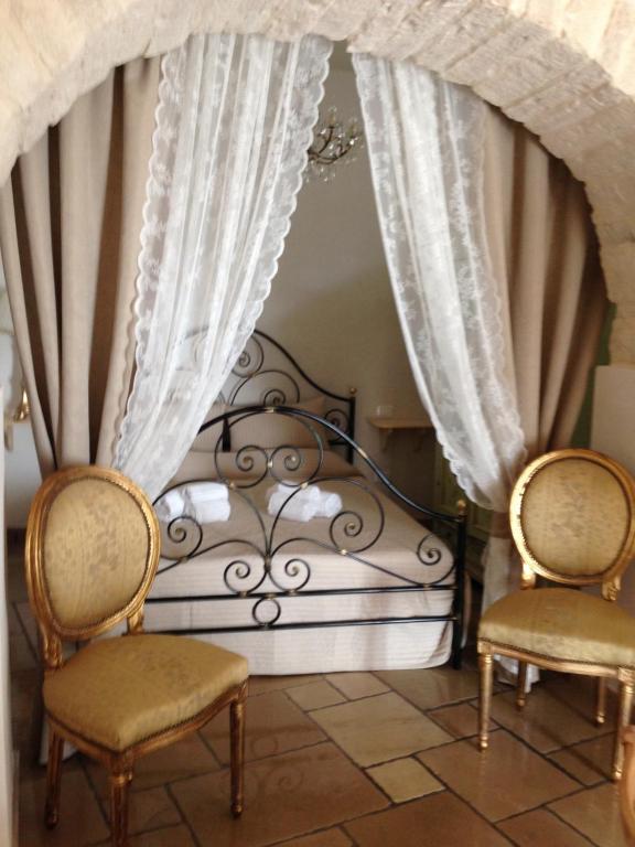Postel nebo postele na pokoji v ubytování Resort Romano in Trulli