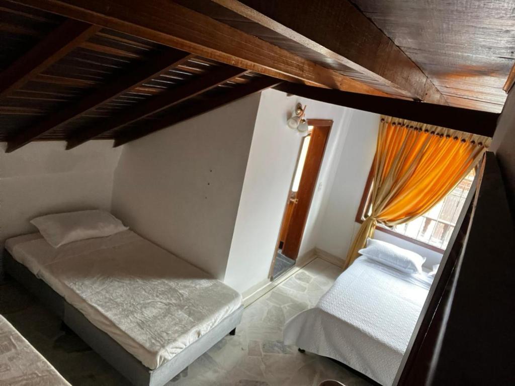 Postel nebo postele na pokoji v ubytování Tikki Lua