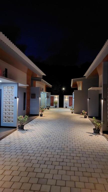 an empty courtyard of a building at night at See Sea Hostel & Resto in Jepara