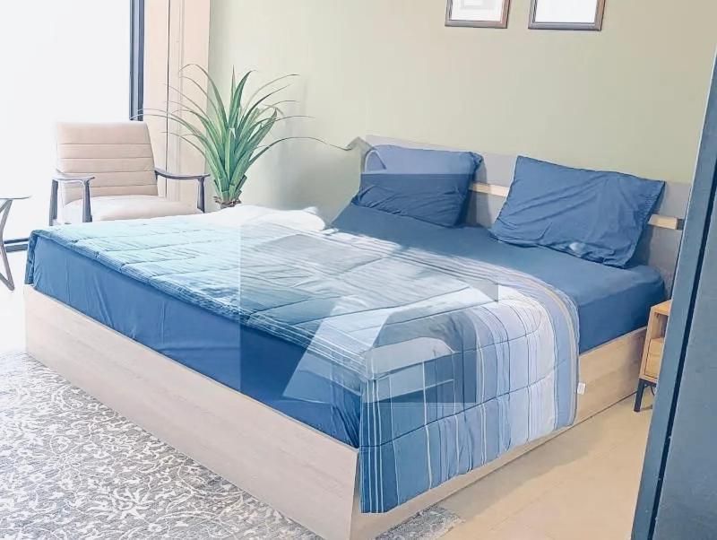 En eller flere senge i et værelse på Imperial Infinity Inn