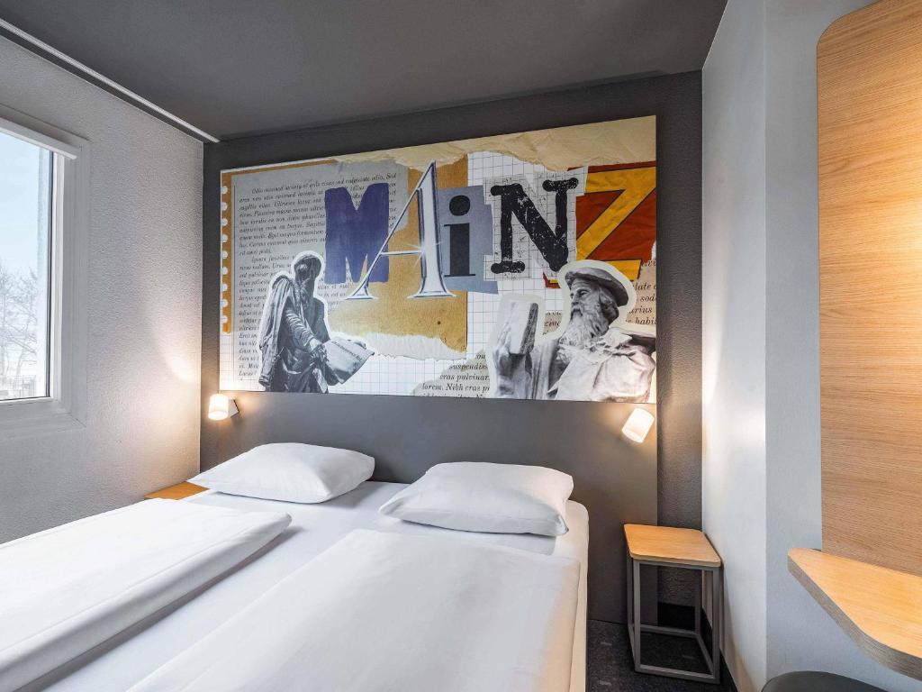 Postel nebo postele na pokoji v ubytování B&B HOTEL Mainz-Süd