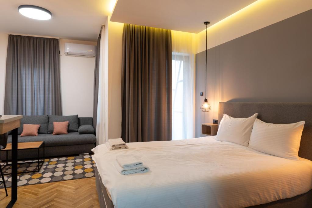 Postel nebo postele na pokoji v ubytování Apartmani Central & Free parking