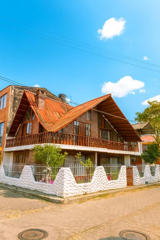 a house with a red roof at Tikki Lua in Cota