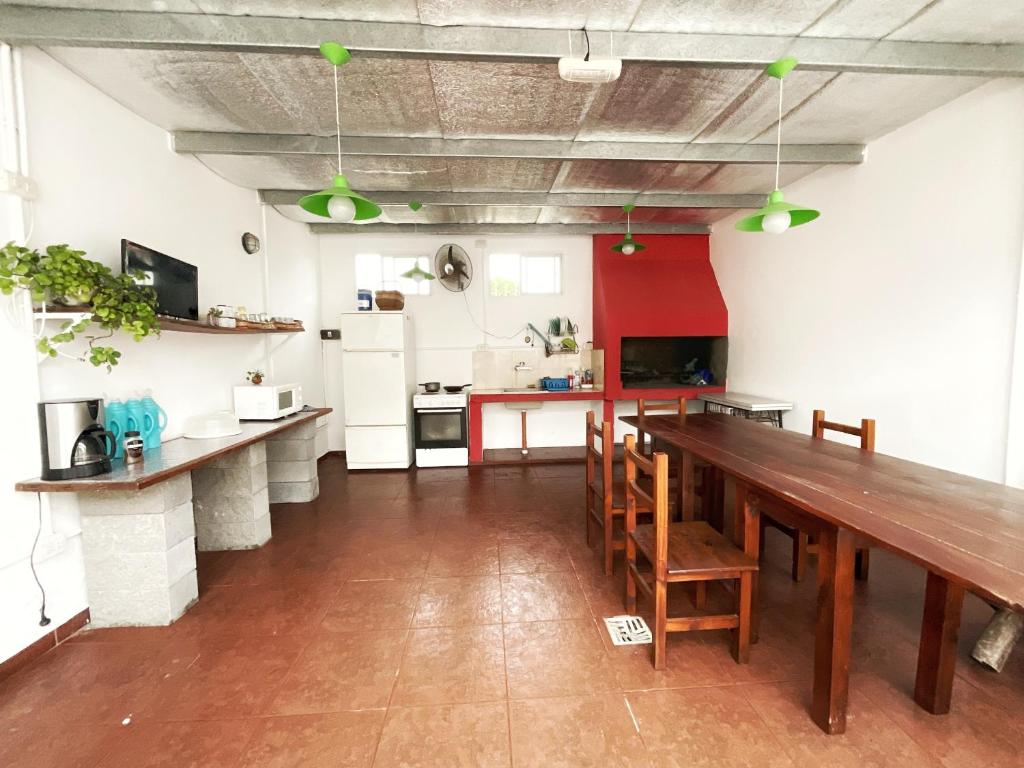 a kitchen with a long wooden table and chairs at Morada del Sol in San Bernardo