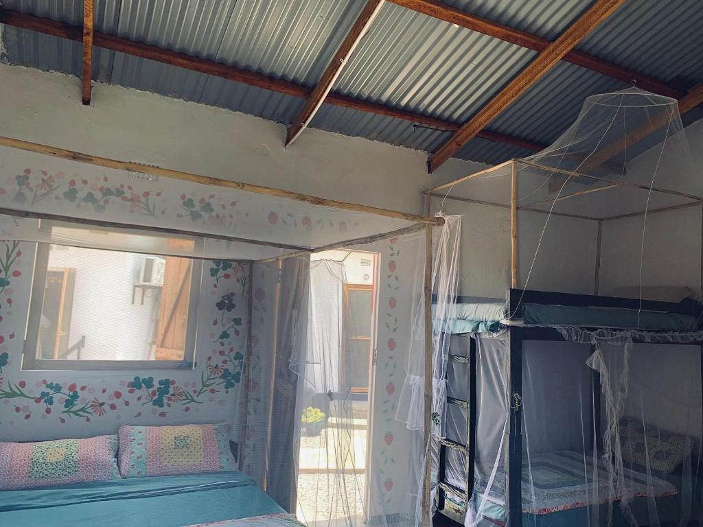 Ein Bett oder Betten in einem Zimmer der Unterkunft Chipatso