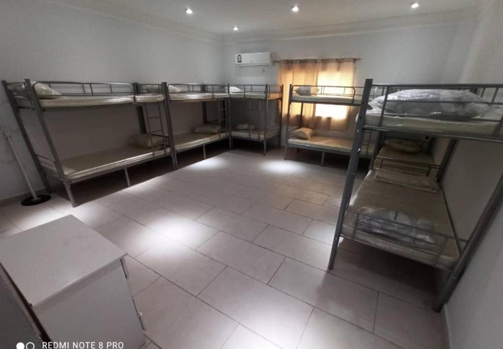 Postel nebo postele na pokoji v ubytování KhavaQatar Hostel 1 بيت مشترك