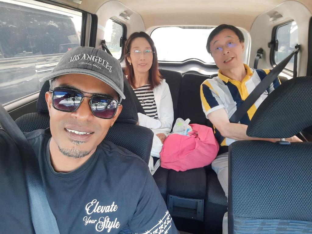 a group of people sitting in the back of a van at Hotel Galaxy in Minneriya