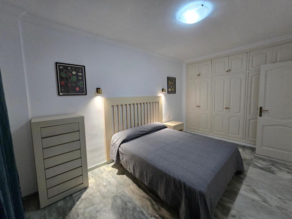 En eller flere senge i et værelse på Bahia de Santiago