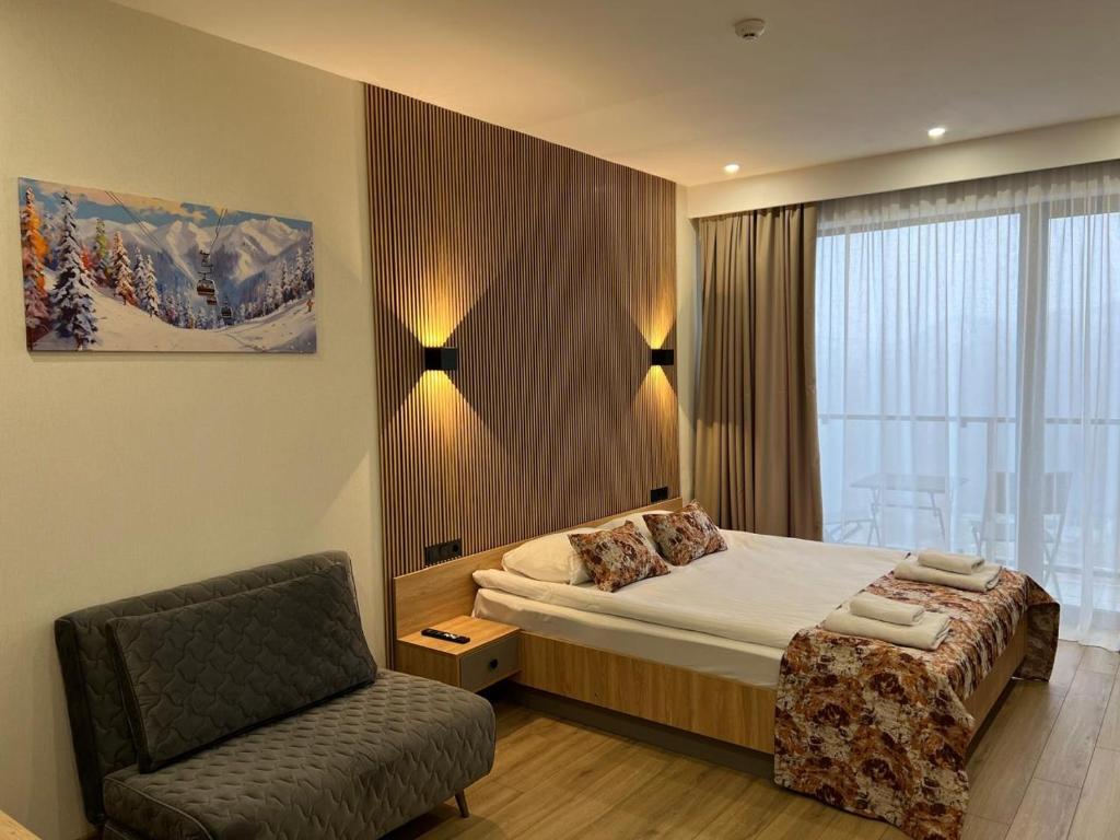 Postel nebo postele na pokoji v ubytování Gudauri Twins 404