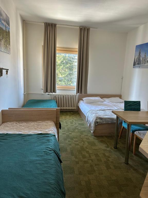 Ένα ή περισσότερα κρεβάτια σε δωμάτιο στο Apartments Konaci Kopaonik