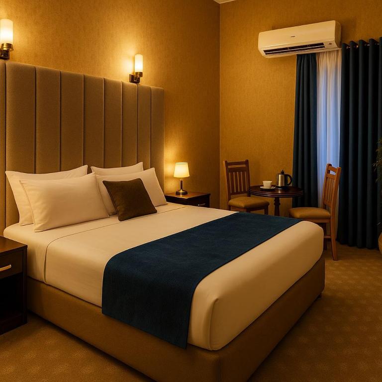a bedroom with a large bed in a hotel room at Veda hotel in Cairo