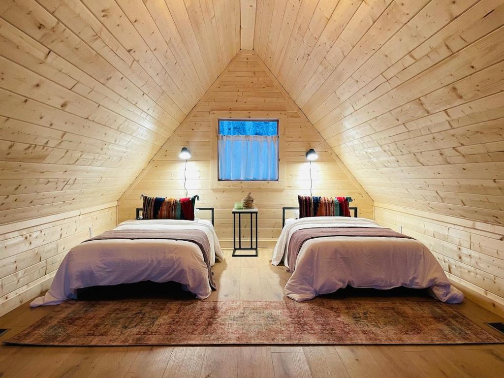 Giường trong phòng chung tại Camp Carter Nordic House