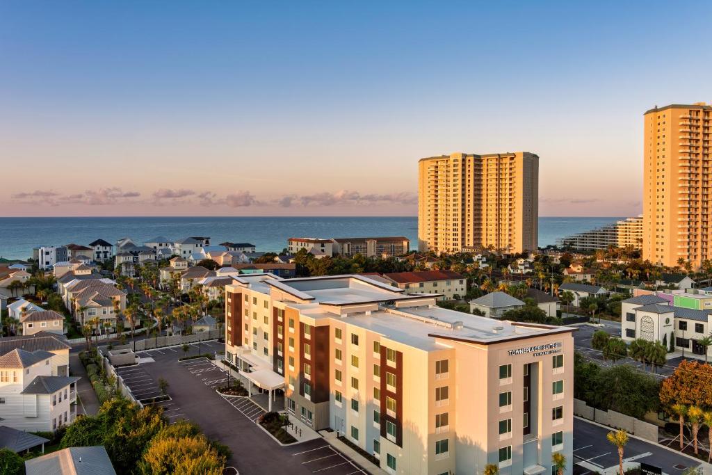 an aerial view of a city with tall buildings and the ocean at TownePlace Suites by Marriott Miramar Beach Destin in Destin