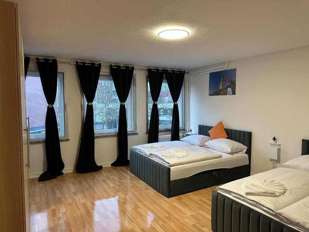 Ένα ή περισσότερα κρεβάτια σε δωμάτιο στο Ferienwohnung im Hamburger Straße 134