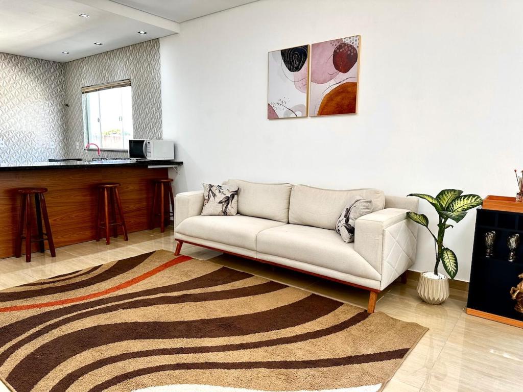 Et opholdsområde på Casa Aconchegante em Hortolândia