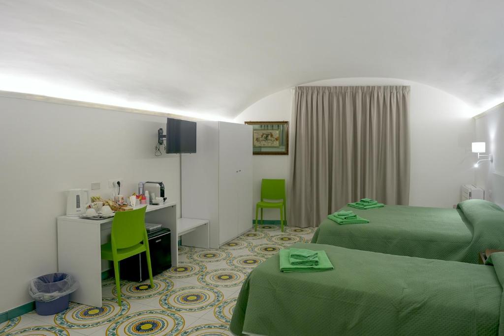 Televiisor ja/või meelelahutuskeskus majutusasutuses Amendola Dream