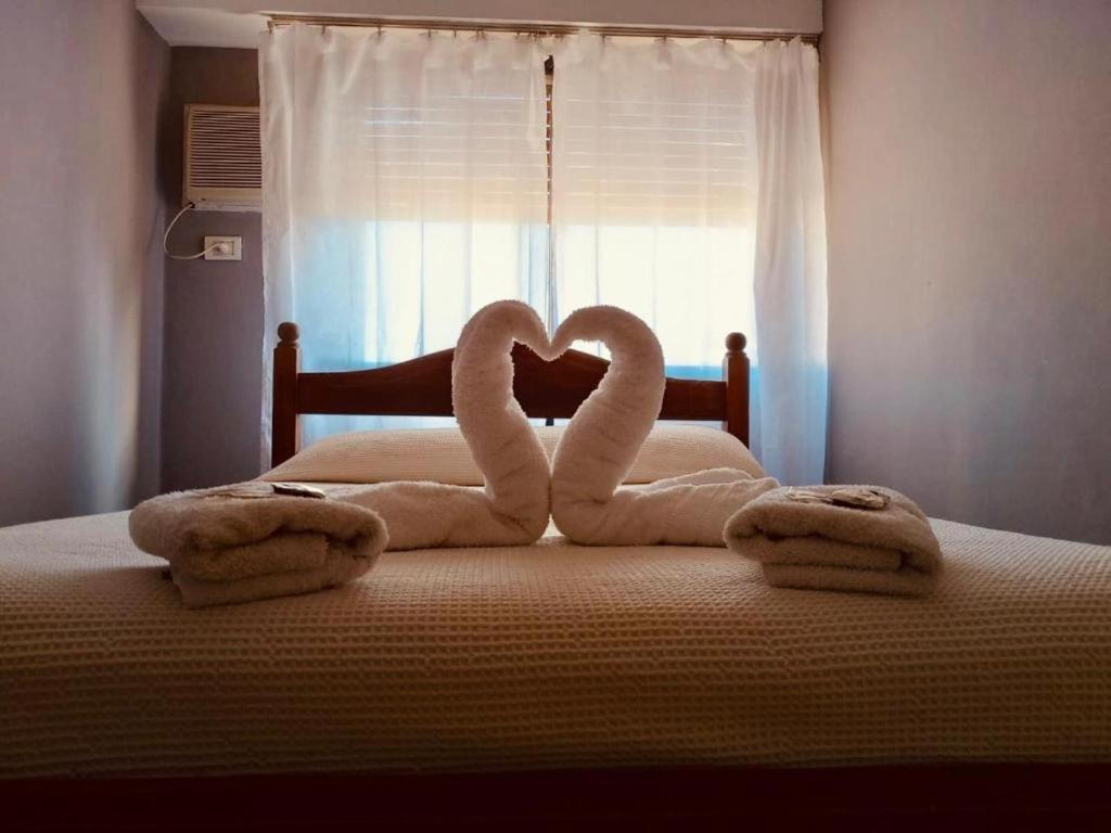 En eller flere senge i et værelse på Hostel IL POINT