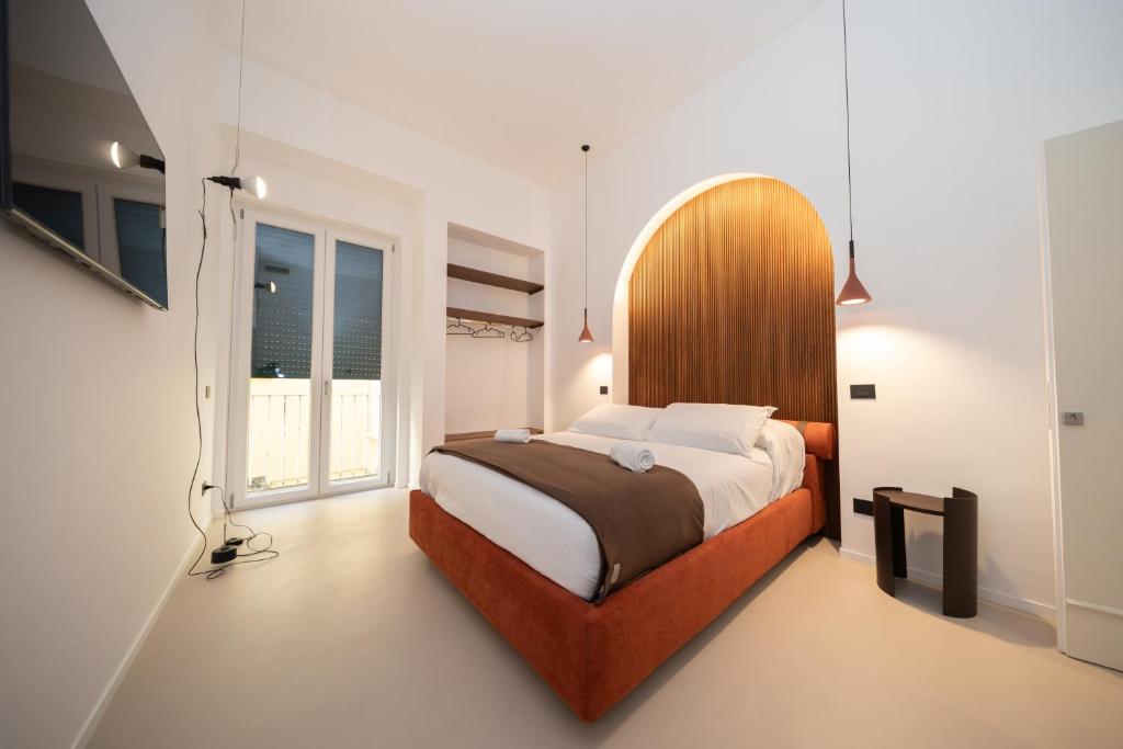 En eller flere senge i et værelse på Donna Isabella - Boutique Rooms