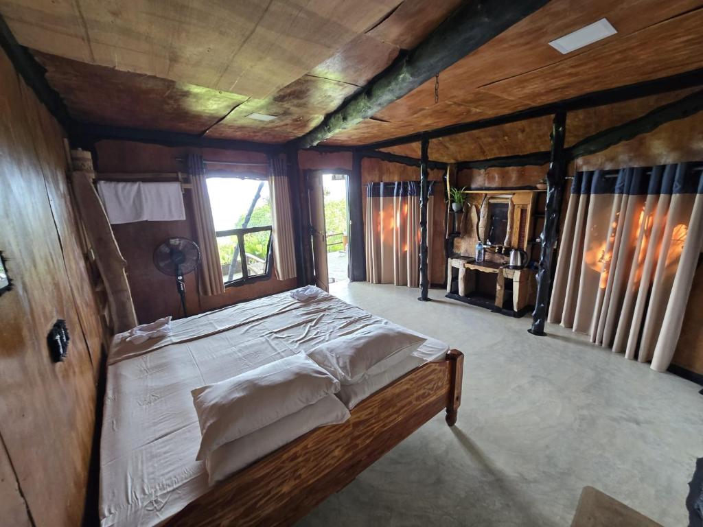 Ένα ή περισσότερα κρεβάτια σε δωμάτιο στο Happybeach Sea view Cabin