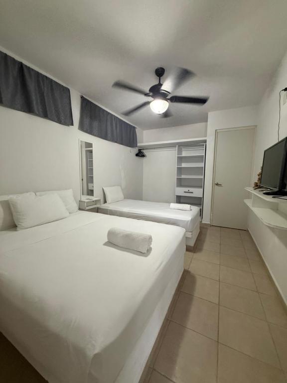 Postel nebo postele na pokoji v ubytování Casa Azul Mahahual