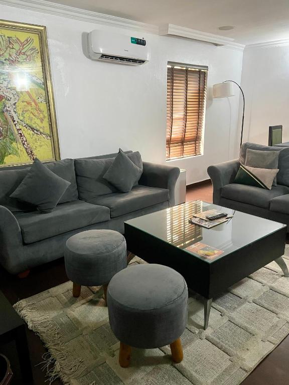 a living room with a couch and a coffee table at The Executive Suite in Lagos