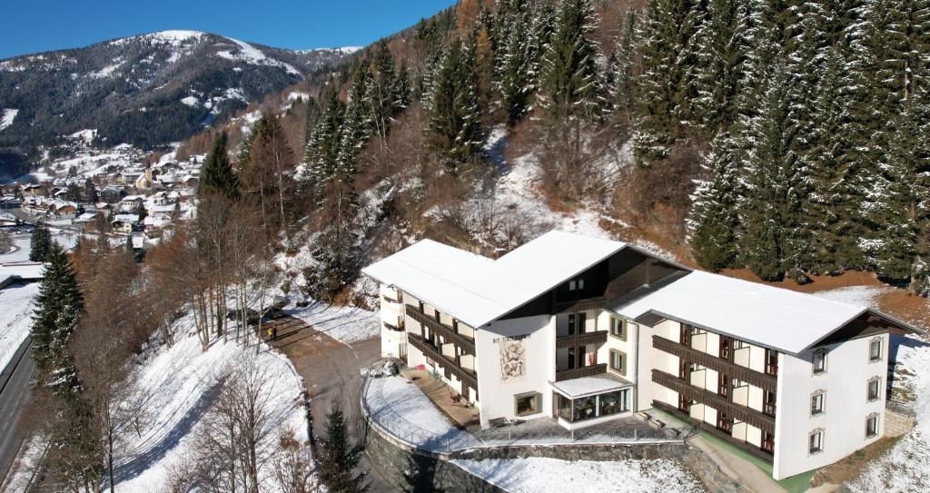 an aerial view of a hotel in the mountains at Hotel Garni Haus Sonnblick in Bad Kleinkirchheim