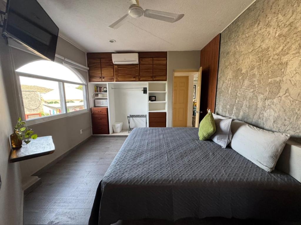 Postel nebo postele na pokoji v ubytování Hotel Bahia Huatulco