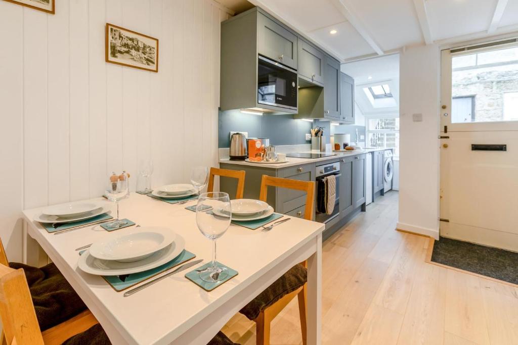 a kitchen and dining room with a table and chairs at 2 Bed in St. Ives oc-b31979 in St Ives