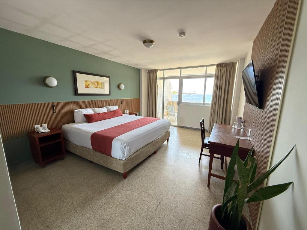 Postel nebo postele na pokoji v ubytování Hotel Royalty