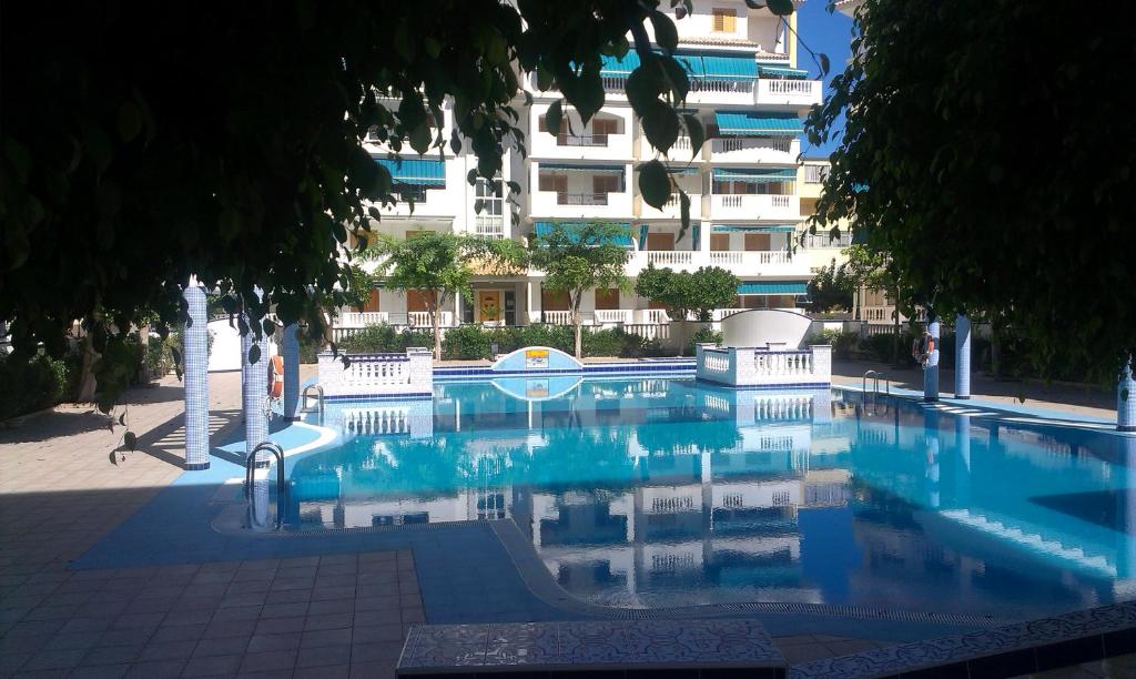 a large swimming pool in front of a building at La Mata Viňamar in La Mata