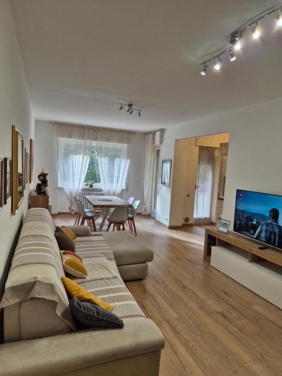a living room with two couches and a television at Casa Sabina in Sanremo