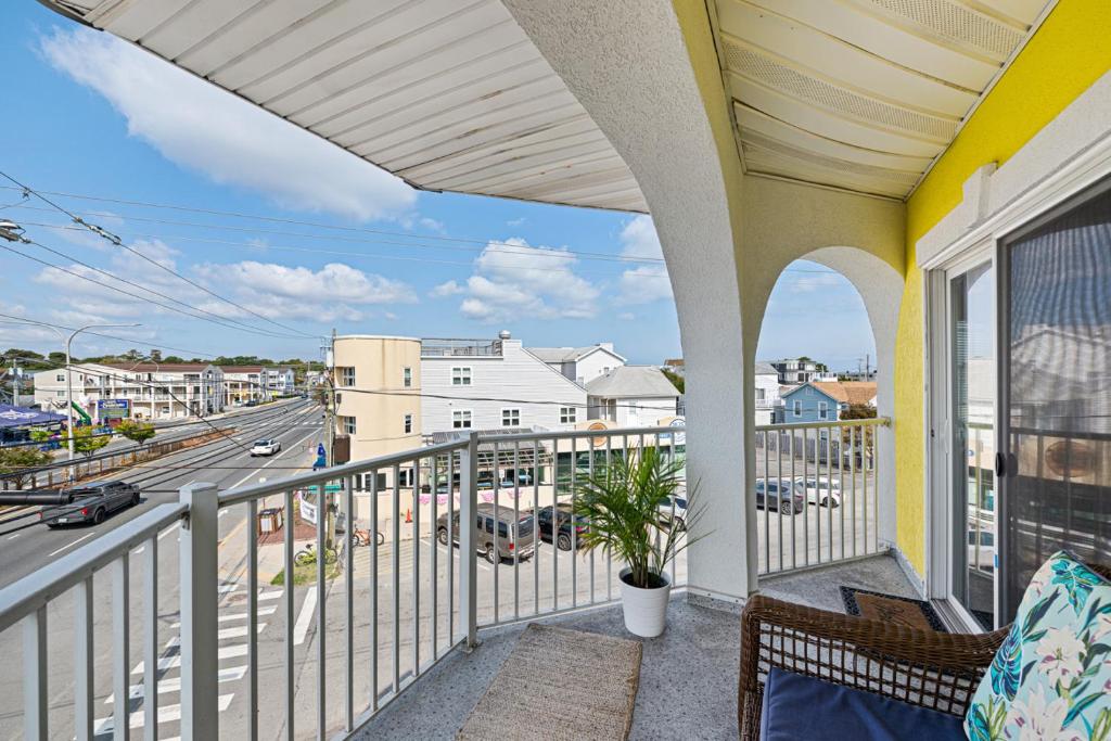 a balcony with a view of a city street at 70 Steps to Beach Dewey Beach in Dewey Beach
