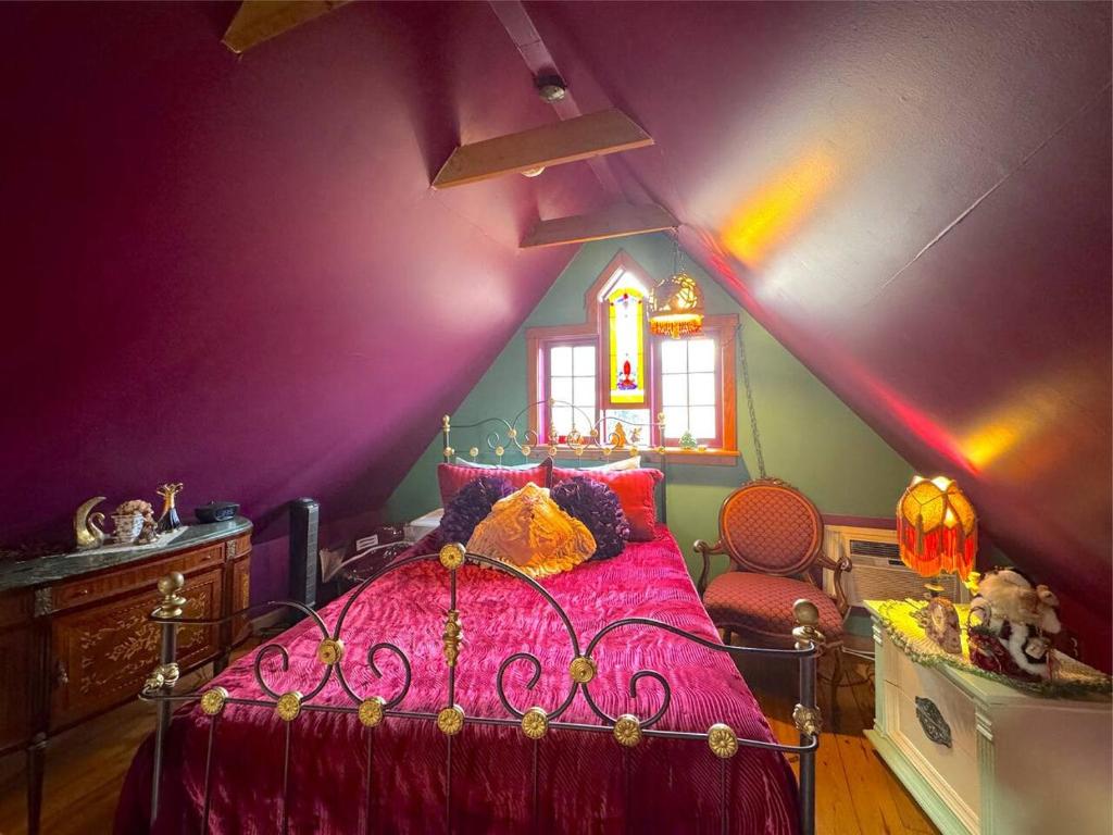 a bedroom with a bed with a purple ceiling at Blue Crystal Hideaway BnB in Eureka Springs