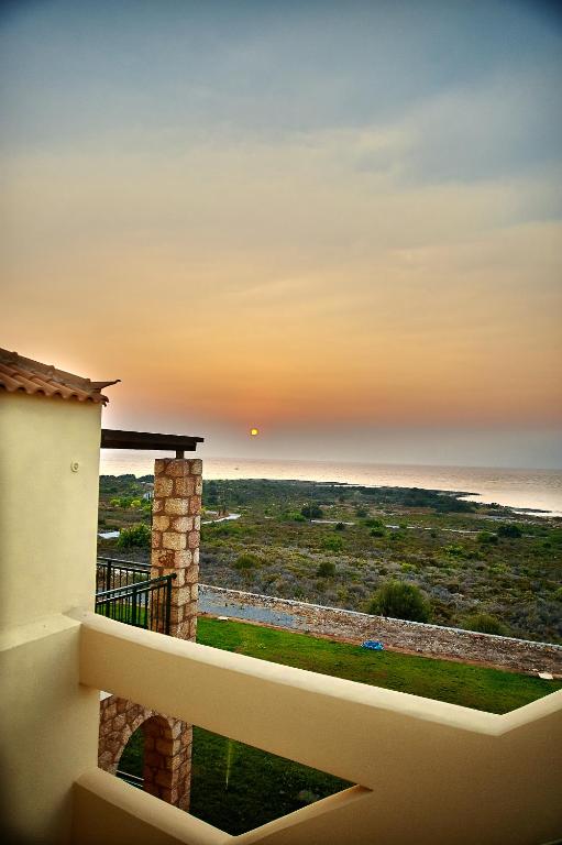 a view of the ocean from the balcony of a house at Element Hotel in Elafonisos