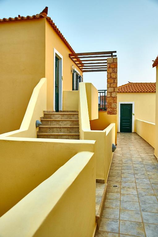 a house with stairs on the side of it at Element Hotel in Elafonisos