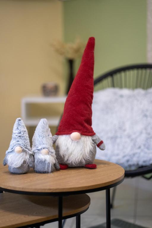 a gnome figurine sitting on a table at 50 Cube - Mountain Nook Karpenisi in Karpenisi