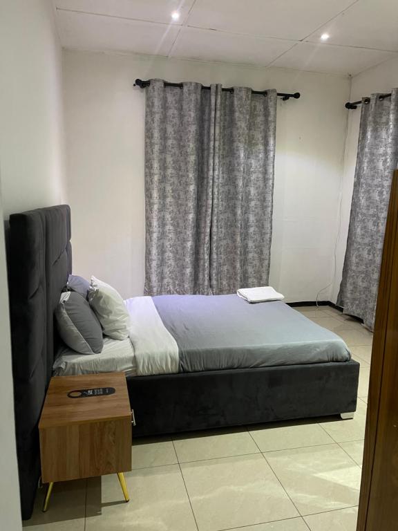 Postel nebo postele na pokoji v ubytování Henderson street lodge