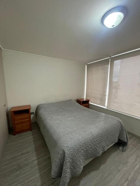 En eller flere senge i et værelse på Alojamiento Alejandra Prieto Norte