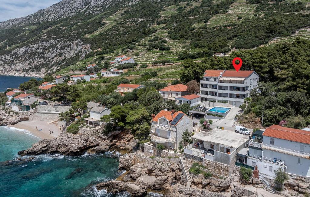 an aerial view of a town on a hill with the ocean at Cozy Apartment In Dingac With Outdoor Swimming Pool in Gornji Dingač