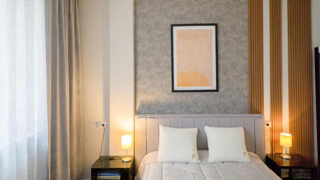 Postel nebo postele na pokoji v ubytování Bella Apartment