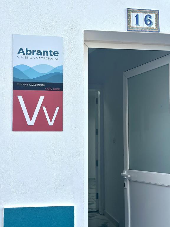 a sign on the side of a building next to a door at VV Abrante in La Restinga