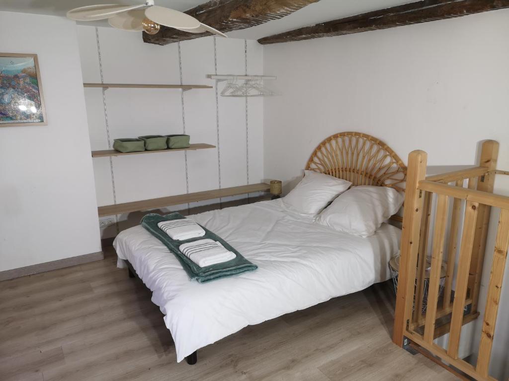 a bedroom with a bed with a tray on it at L'instant Doubs in Baume-les-Dames