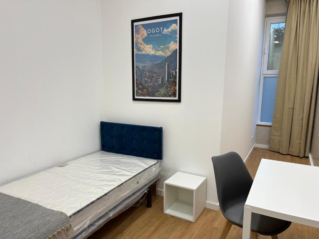 En eller flere senge i et værelse på BBGH Guest House